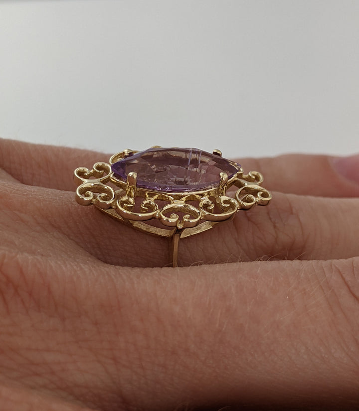 10K AMETHYST MARQUISE 7X15 WITH SWIRL BOARDER 3.1 GRAMS