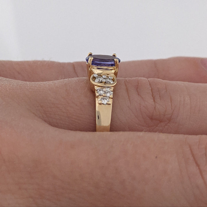 14K TANZANITE OVAL 5X7 WITH .10 DIAMOND TOTAL WEIGHT (10) ROUND ESTATE RING 3.2 GRAMS