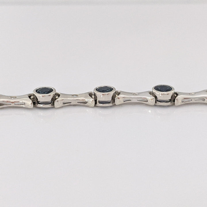 14K WHITE SAPPHIRE ROUND (14) 4MM BEZEL WITH .13 DIAMOND TOTAL WEIGHT ESTATE BRACELET 12.7 GRAMS