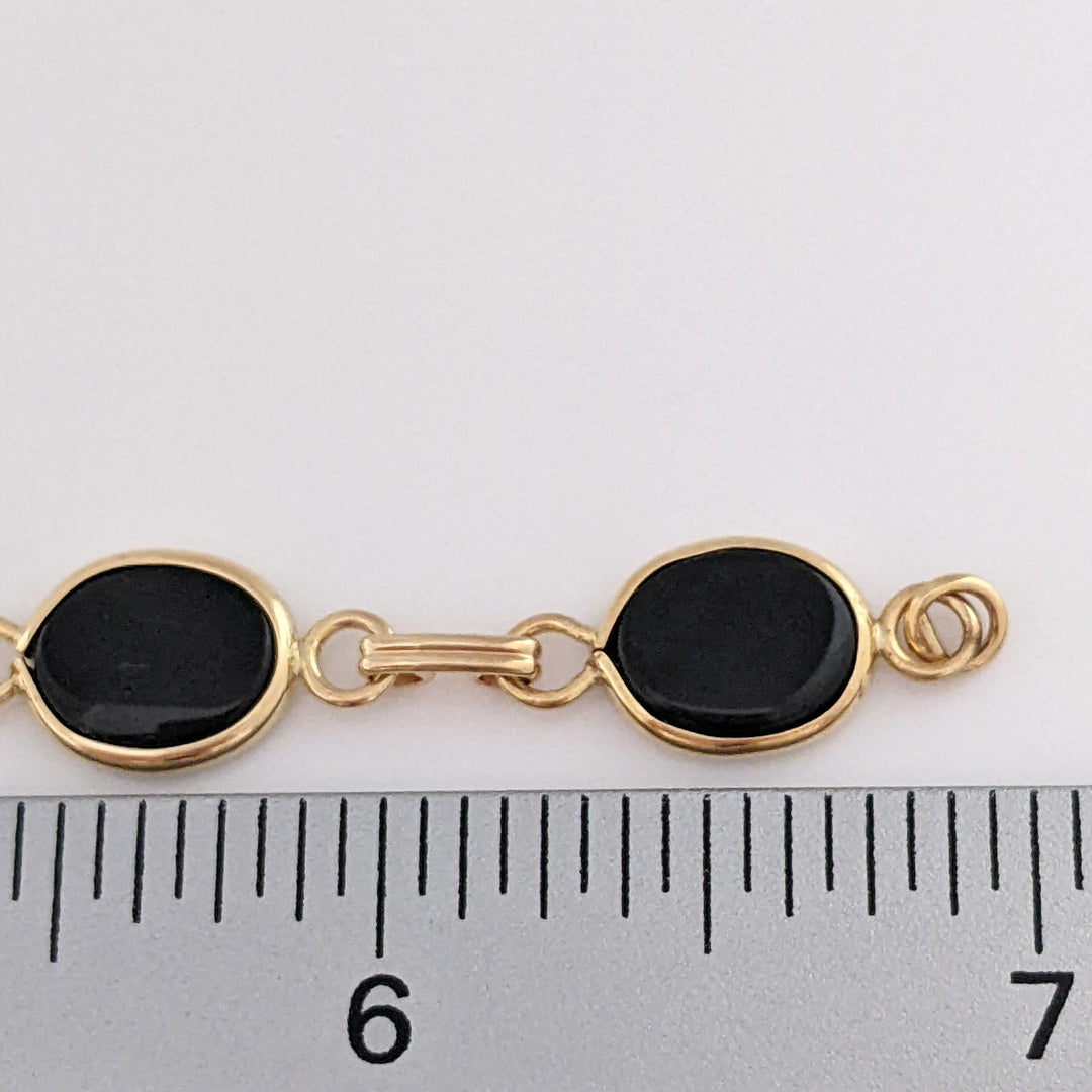 14K ONYX OVAL 7X10 (7) ESTATE BRACELET 7.1 GRAMS