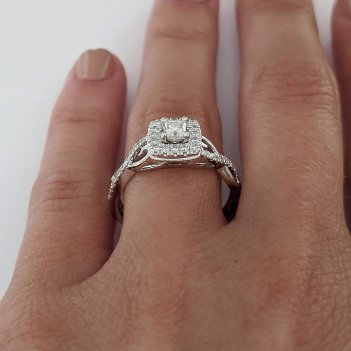 10K WHITE .48 CARAT TOTAL WEIGHT SI2 H DIAMOND PRINCESS CUT (1) ROUND (36) ESTATE HALO TWIST RING 2.8 GRAMS