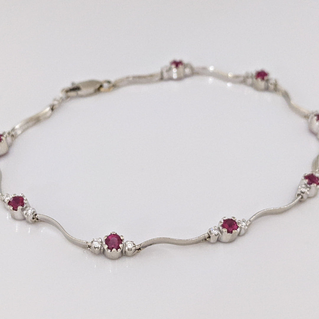14K WHITE RUBY ROUND (8) 3MM WITH .16 DIAMOND TOTAL WEIGHT (16) ESTATE WAVY BRACELET 4.3 GRAMS