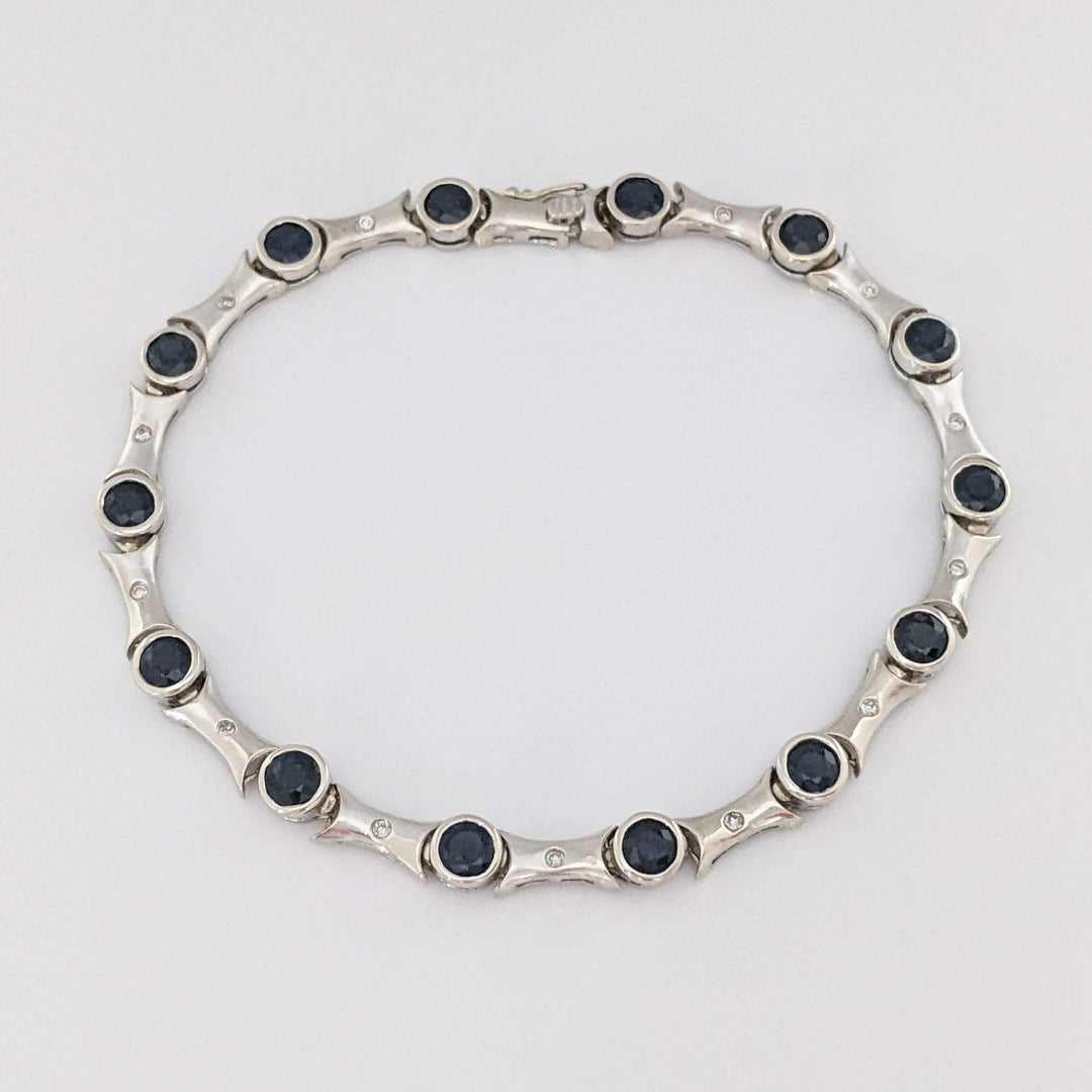 14K WHITE SAPPHIRE ROUND (14) 4MM BEZEL WITH .13 DIAMOND TOTAL WEIGHT ESTATE BRACELET 12.7 GRAMS