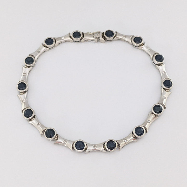 14K WHITE SAPPHIRE ROUND (14) 4MM BEZEL WITH .13 DIAMOND TOTAL WEIGHT ESTATE BRACELET 12.7 GRAMS