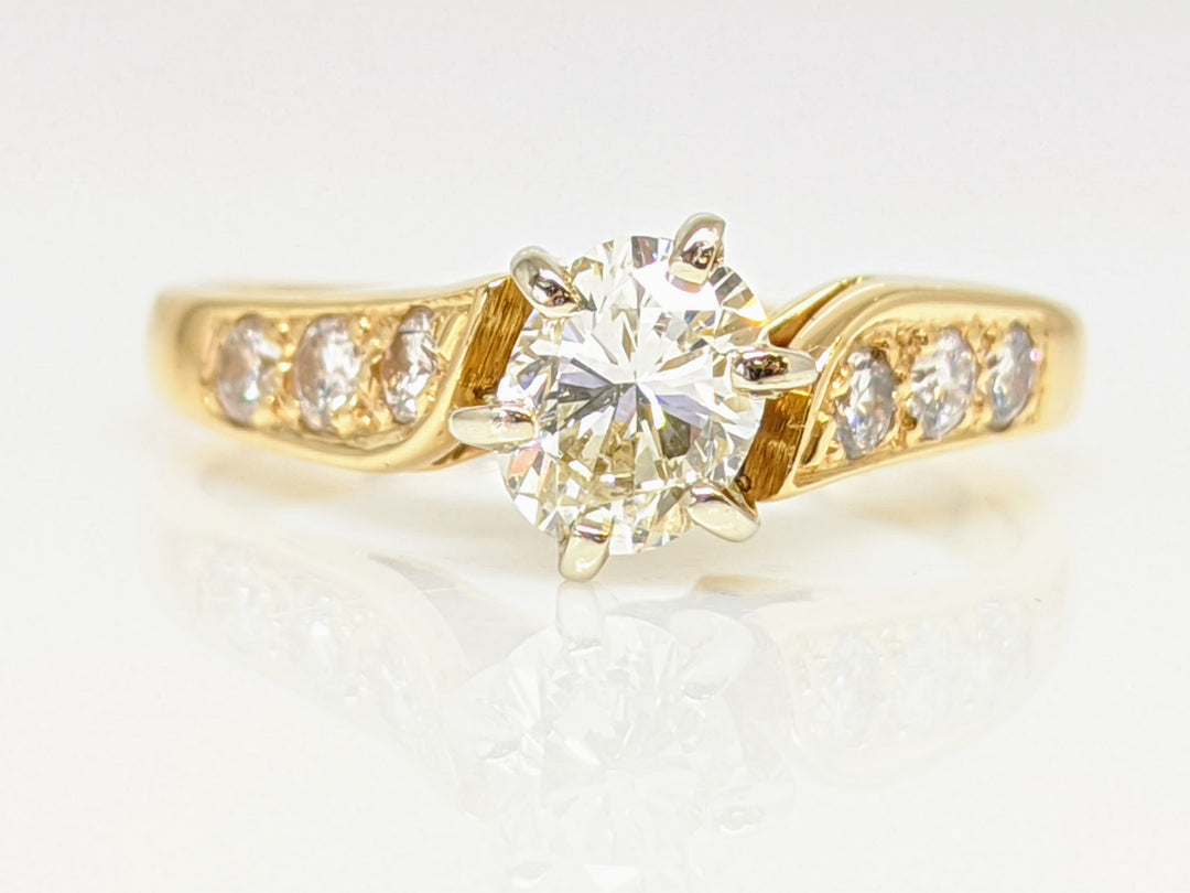 14K .62 CARAT TOTAL WEIGHT VS2 J DIAMOND OVAL WITH (6) ROUND MELEE ESTATE RING