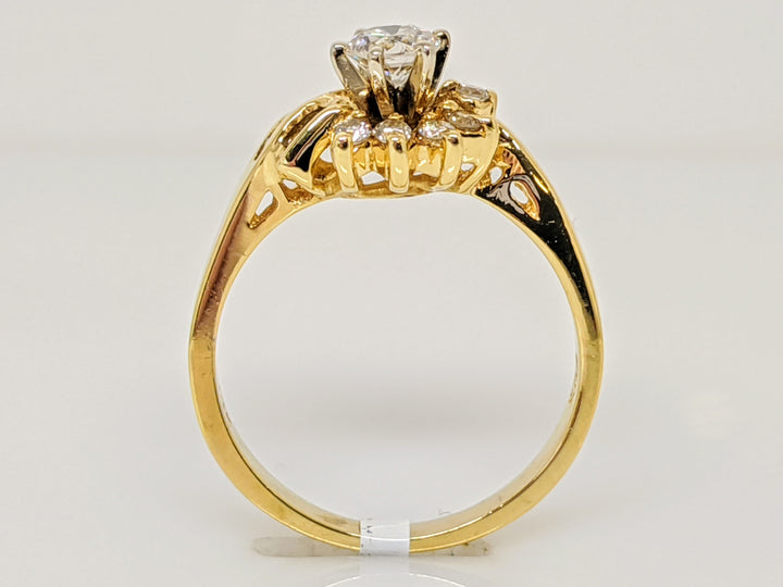 14K .71 CARAT TOTAL WEIGHT SI2-I1 H DIAMOND ROUND WITH BAGUETTE(6) AND MELEE(12) ESTATE RING