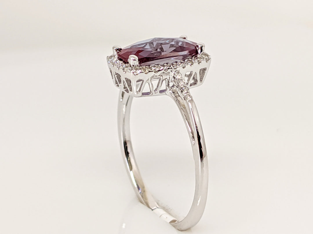 14KW LAB CREATED ALEXANDRITE EMERALD CUT 5X10 WITH .16 DIAMOND TOTAL WEIGHT ESTATE RING