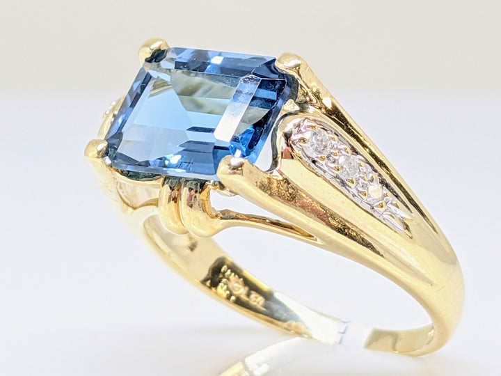 10K BLUE TOPAZ EMERALD CUT 8X10 WITH (6) MELEE ESTATE RING 4.5 GRAMS