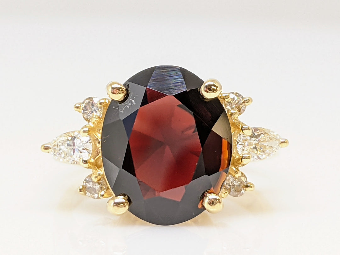 14K GARNET OVAL 9X12 WITH (2) PEAR AND (4) ROUND DIAMONDS ESTATE RING 4.9 GRAMS