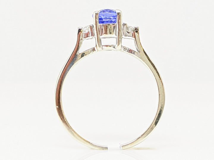 14KW TANZANITE OVAL 5X7 WITH .12 DIAMOND TOTAL WEIGHT ESTATE RING 4.9 GRAMS