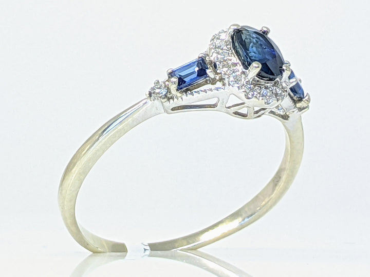 14KW SAPPHIRE OVAL 4X6 WITH (2) SAPPHIRE BAGUETTES AND .12 DIAMOND TOTAL WEIGHT ESTATE RING 2.1 GRAMS