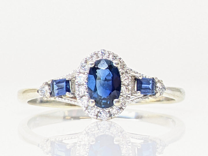 14KW SAPPHIRE OVAL 4X6 WITH (2) SAPPHIRE BAGUETTES AND .12 DIAMOND TOTAL WEIGHT ESTATE RING 2.1 GRAMS