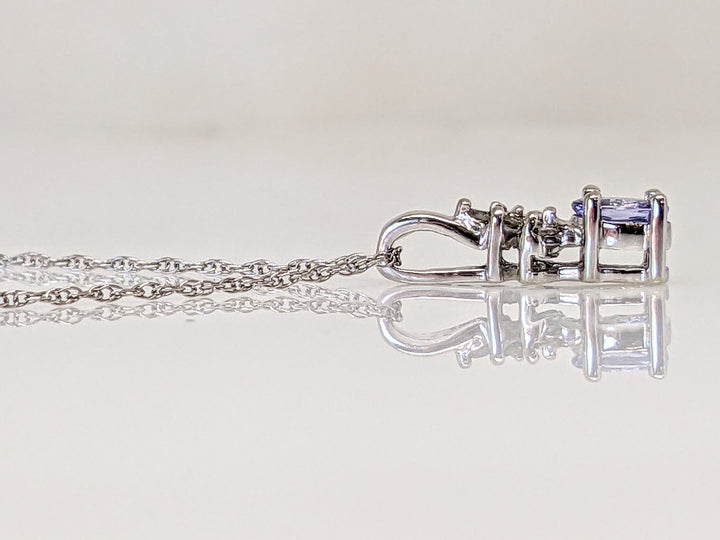 10KW TANZANITE OVAL 4X5 WITH DIAMOND BAGUETTE (2) AND ROUND (2) ESTATE PENDANT & CHAIN 1.5 GRAMS
