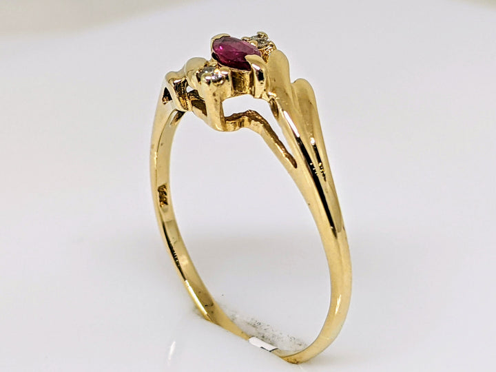 14k RUBY MARQUISE 2.5X5 WITH (2) MELEE BYPASS ESTATE RING 1.9 GRAMS