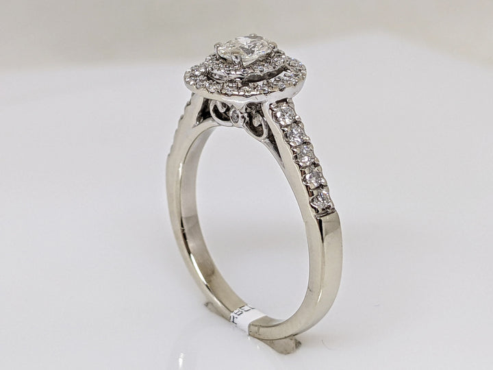 14kW .68 CARAT TOTAL WEIGHT SI1 H DIAMOND OVAL WITH (47) ROUND MELEE HALO ESTATE RING 3.4 GRAMS