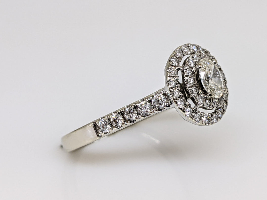 14kW .68 CARAT TOTAL WEIGHT SI1 H DIAMOND OVAL WITH (47) ROUND MELEE HALO ESTATE RING 3.4 GRAMS