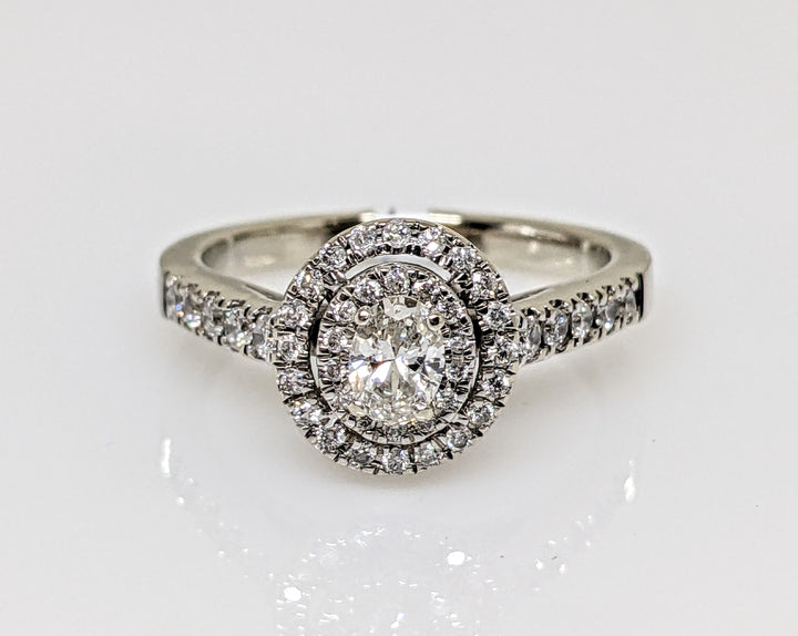 14kW .68 CARAT TOTAL WEIGHT SI1 H DIAMOND OVAL WITH (47) ROUND MELEE HALO ESTATE RING 3.4 GRAMS