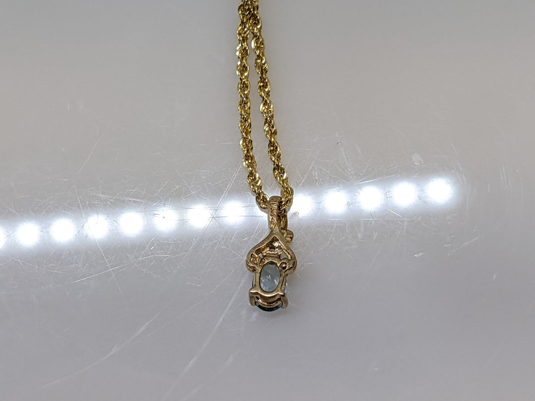 14k AQUAMARINE OVER 4X6 WITH MELEE ESTATE PENDANDT AND CHAIN 1.8 GRAMS